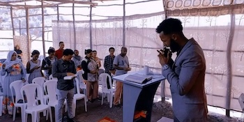 Ezra Ward preaching in Ethiopia